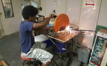 Cutting angle iron to make five battery trays. 